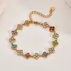 Pulsera de trébol de cuatro hojas estilo francés transfronteriza europea y americana, lujo ligero con un toque de alta gama, llena de piedras de circonita, joyería de acero inoxidable