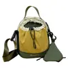 Bolsa ligera para botella de agua de exterior, cierre de cordón unisex, bolso de un solo hombro, para viajes casuales, senderismo, bolso cruzado, bolsillo para teléfono con bloques de color