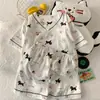 Ropa de Casa de Nuevo Estilo para Niñas, Conjunto de Algodón Nube, Pijama de Pantalones Cortos y Manga Corta, Dulce y Lindo con Estampado y Cuello en V, Comercio Exterior Transfronterizo