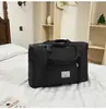2025 bolsa de almacenamiento para ropa de mudanza acolchada de doble capa transfronteriza bolsa de equipaje portátil con ruedas al por mayor
