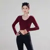 Nuevo top de yoga para mujer, con un elegante diseño en la espalda, cuello redondo, mangas largas, efecto adelgazante, estilo versátil y longitud corta, perfecto para fitness y deportes.. Disponible para venta al por mayor