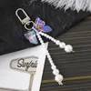 Nuevo Colgante Creativo de Cadena Colgante con Lazo de Perlas para Bolso, Funda de Teléfono, Llavero, Adorno, Exquisito Accesorio de Regalo Pequeño