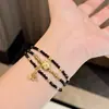 Collar con Borla de Espinela Negra de Tono Oscuro Retro de Gama Alta Estrella de Cinco Puntas Diseño de Nicho Cadena para Clavícula Versátil para el Viaje