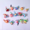 Agujero de spot caja ciega de música muñeca accesorios pequeños huevo Sanrio kulomi dios original llavero pequeño regalo colgante