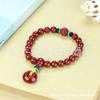 Pulsera de cinabrio rojo al por mayor con alto contenido de arena de oro púrpura de 8 m de cuentas redondas con colgante pulsera de la paz golondrina bestia valiente viva