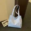 Otoño 2026 Nuevo Elegante Fresco Simple Gran Capacidad Lona Artístico Casual Estudiante Bolso de Hombro Único Portátil Tote