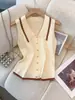 Top de punto sin mangas estilo francés con un pequeño diseño inspirado en Chanel, cuello falso, corte ajustado, corto y suave, tejido de punto para mujer amigable con la piel
