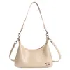 Bolso de axila retro y minimalista para mujer, nueva colección otoño 2026, con un diseño único, un bolso de hombro elegante y versátil que también se puede llevar cruzado.