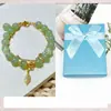 Estilo Celebridade da Internet Igual Duas Gerações Huan Imitação Natural Hetian Jade Pulseira Corda Elástica Teto de Lótus Pulseira Luxo Leve Pulseira de Alta Qualidade Presente