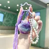 Llavero de concha láser con temática oceánica, colgante creativo de concha degradada para mochila, llavero de cadena de perlas femenino