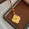 Nuevo modelo de collar de moneda de trébol de cuatro hojas con tachuelas de oro simulado, cadena floral para clavícula de diseño nicho para mujer, joyería Meilong