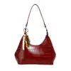 Bolso Cruzado de Hombro Único con Colgante Texturizado Color Sólido Casual Estilo Coreano Verano 2026 Nuevo Elegante Bolso Dumpling para Mujer