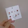 Golpea la cura de Azul ~ 2022 pequeño juego de pendientes de Margarita diseño de nicho pendiente de oreja pendientes estilo Ins para mujer
