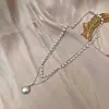 Collar con colgante de perlas de doble capa minimalista para mujer, versátil y elegante, con un aire de moda de alta gama, cadena para la clavícula de diseño único