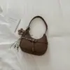 Nova bolsa de ombro estilo francês para o início do outono de 2026, bolsa de meia-lua de alto valor, bolsa de ombro simples, bolsa transversal casual estilosa, moderna