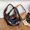 Marca niche coreana matinkim Mismo estilo que Ningning Correa de hombro retorcida Bolso de un solo hombro para el día a día Bolso croissant para debajo del brazo