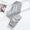 Pantalones Deportivos de Seda Helada Elástica de Verano Caliente Transfronterizos Casuales Combinan con Todo Sueltos Sueltos Estampado Fijo de Logo para Parejas