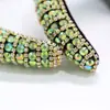 Diadema ancha de pedrería europea y americana