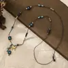 2026 Collar Retro de Cuerda Tejida a Mano con Cuentas de Acero de Titanio para Mujer Diseño de Nicho Estilo Étnico Cadena para Suéter Accesorios de Flor