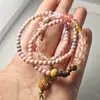 Novo bracelete feminino multicamadas temperamento retrô empilhado nicho pedra vermelha madeira trançado pulseira rede vermelha estilo atacado