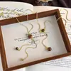 Cadena de suéter larga de ojo de tigre de nuevo estilo para Otoño e Invierno, Elegantes y a la moda Accesorios de Decoración para Fotos de Otoño e Invierno