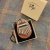 Instrumento Musical al por Mayor 8 Tonos Mini Piano de Pulgar Piano de Dedo Kalimba Madera Maciza Cristal Piano de Cinco Dedos Portátil Instrumento Musical para Niños