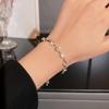Pulsera coreana de acero de titanio con circonita super flash para mujer, pulsera de temperamento de lujo ligero de alta gama, celebridad de internet, simple, versátil, accesorios de mano al por mayor