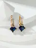 Pendientes europeos y americanos de brazo retorcido con circonita púrpura cuadrada transfronterizos, pendientes de alta gama con circonita púrpura y diamantes completos