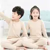 Comercio Exterior Europeo y Americano Conjunto de Ropa Interior de Fibra Auto-Calentable Cálida de Felpa para Niños Camisa de Otoño para Niños Capa Interior Pantalones de Otoño e Invierno