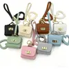 Mini bolsa de presente simples pode guardar fones de ouvido e chaveiros, bolsa de fone de ouvido de cor sólida, pingente de couro, bolsa quadrada criativa, bolsa longa