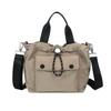 Versión Coreana de Bolso de Tela de Nylon Ligero Dongdaemun 2025 Nuevo Bolso de Cubo Casual Nicho Versátil Bolso de Hombro