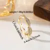 Anillo de cuerda retorcida de diseño único con circonita, disponible en oro y plata, accesorio hueco para mujer, joyería al por mayor transfronteriza