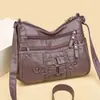 Bolso de textura suave de piel para mujer, nuevo modelo 2025, simple y elegante, bolso versátil para mamá, moderno bolso de hombro y cruzado de gran capacidad