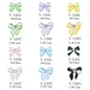 Celebridad en línea joyería para uñas lazo de cinta aleación pintura en aerosol rhinestone japonés lazo decoraciones para uñas al por mayor