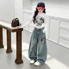 Roupas de Outono para Meninas Calças Jeans 2026 Novo Estilo Coreano Roupa de Fora Estilosa Calças Casuais Calças Largas Soltas para Meninas Primavera e Outono