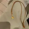 Popular en Xiaohongshu: Collar de Moneda de Cobre Color Dorado para Mujer, Colgante de Borla Vintage, Cadena de Clavícula Simple y Versátil con Forma de Corazón, Al por Mayor
