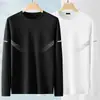 Camiseta elástica de manga larga para hombre, corte holgado, adecuada para primavera y otoño, color liso, versátil, se puede usar como atuendo de pareja, capa interior para hombre