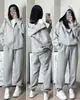Conjunto deportivo casual transfronterizo para primavera y otoño, sudadera con capucha holgada estilo coreano y conjunto de pantalones jogger para correr para estudiantes