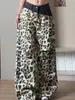 Jeans rotos de patchwork bicolor con estampado de leopardo para hombre y mujer, pantalones estilo vintage hiphop wasteland, pantalones anchos de alta calle americanos