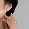 Pendientes de corazón calado con microincrustaciones de circonita, transfronterizos europeos y americanos, nuevo diseño de lujo ligero, pendientes de tornillo retorcido para mujer