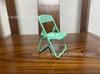 Nueva silla pequeña creativa, soporte de escritorio para teléfono móvil, nuevo taburete Macaron, soporte plegable para teléfono móvil