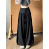 Calça marrom de cintura alta com botões para mulheres, novo estilo outono 2026, caimento solto, modeladora, com perna fluida afunilada e design de calça lanterna, adequada para figuras em formato de pera