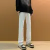 Otoño 2026 Pantalones Vaqueros Occidentales de Color Sólido de Alta Calidad para Hombre Estilo Retro Americano Sencillos Adelgazantes que Alargan las Piernas Micro-Campana de Moda