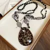 Collar Redondo Multicapa de Perlas y Cuentas Moda Temperamento Cadena para Suéter Elegante Lujo Ligero Sensación de Alta Gama Adorno de Collar Transfronterizo Europeo y Americano