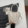 Bolsa tote estilo balde, simples e casual para mulheres, nova coleção primavera 2026, moderna e estilosa, com uma textura única, pode ser usada como bolsa de ombro ou bolsa transversal