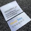 FUENTE etiqueta de lavado de ropa de fábrica etiqueta de lavado personalizada etiqueta tejida plegable de alta densidad etiqueta principal etiqueta lateral marca de envío