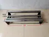 Máquina Pequeña de Extendido de Tela para Fábricas de Ropa Tiendas de Tela Tela Publicitaria Papel Tapiz etc.. Máquina desenrolladora de tela para materiales cilíndricos Bastidor extensible de tela