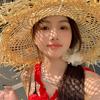 Sombrero de paja Lafite de ala grande para mujer, primavera y verano, nuevo estilo festivo, sombrero para el sol hueco, sombrero para el sol de playa junto al mar, moderno