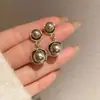 Aretes de Perla Gris para Mujer de Lujo Ligero Clavos de Oreja de Gama Alta 2024 Nuevas Explosiones Otoño e Invierno Nicho Joyería de Oreja Elegante Única