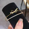 Estilo Lujo Ligero Europeo y Americano Pulsera Abierta de Doble Capa Cuadrada Calabaza con Lazo de Zirconia Joyería de Nicho Elegante de Alta Gama para Mujeres